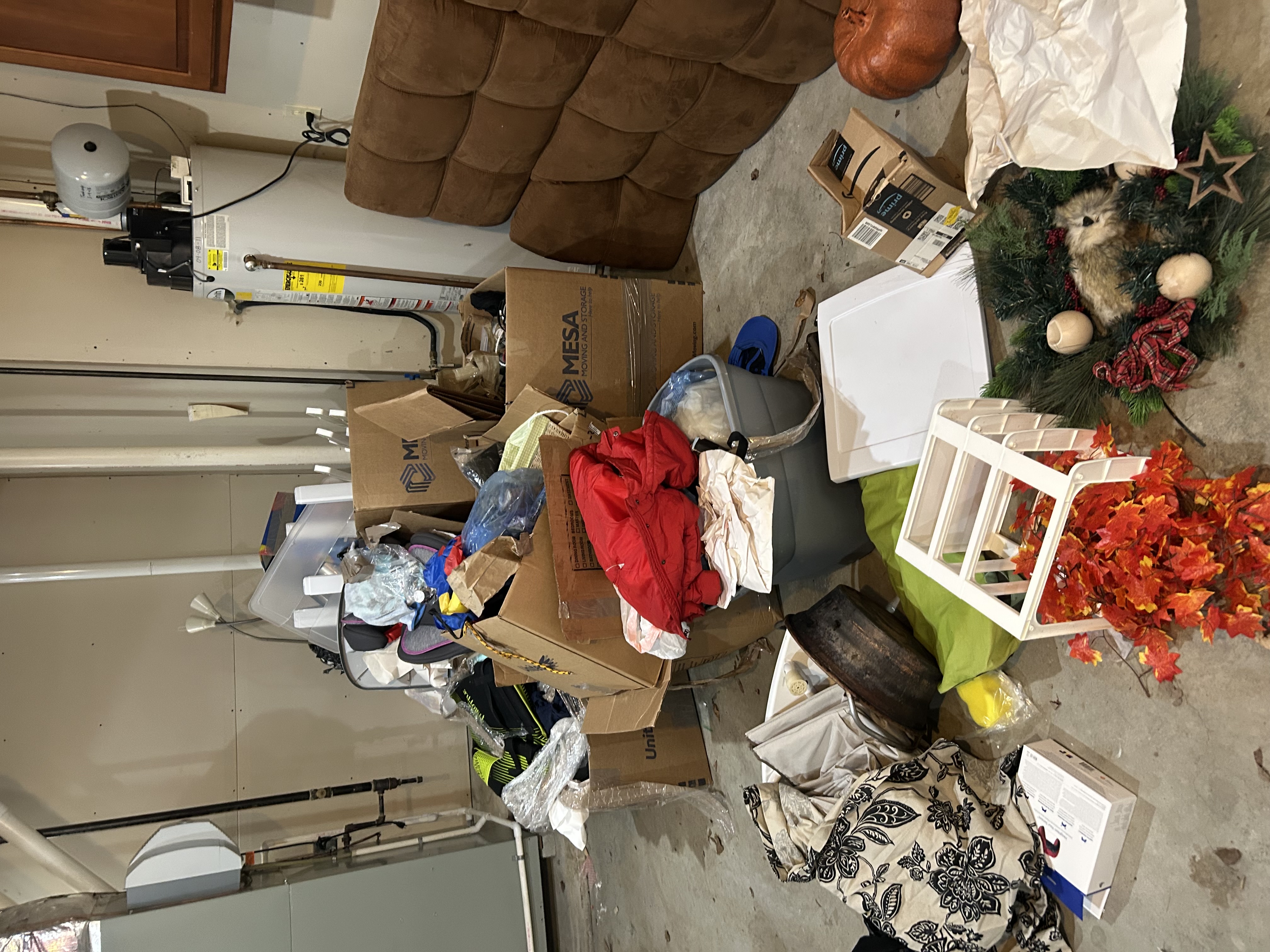 Junk Squad crew carrying items out during an inside removal job in Central PA